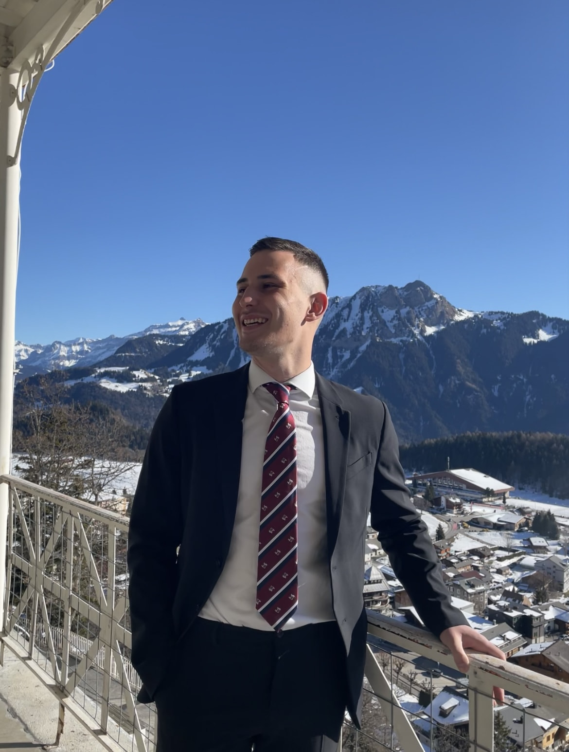 Nikola standing on the balcony of the Leysin campus