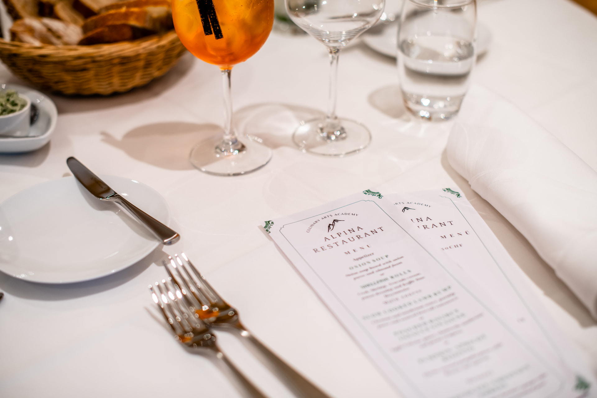 A close shot of cutlery at a table in a restaurant